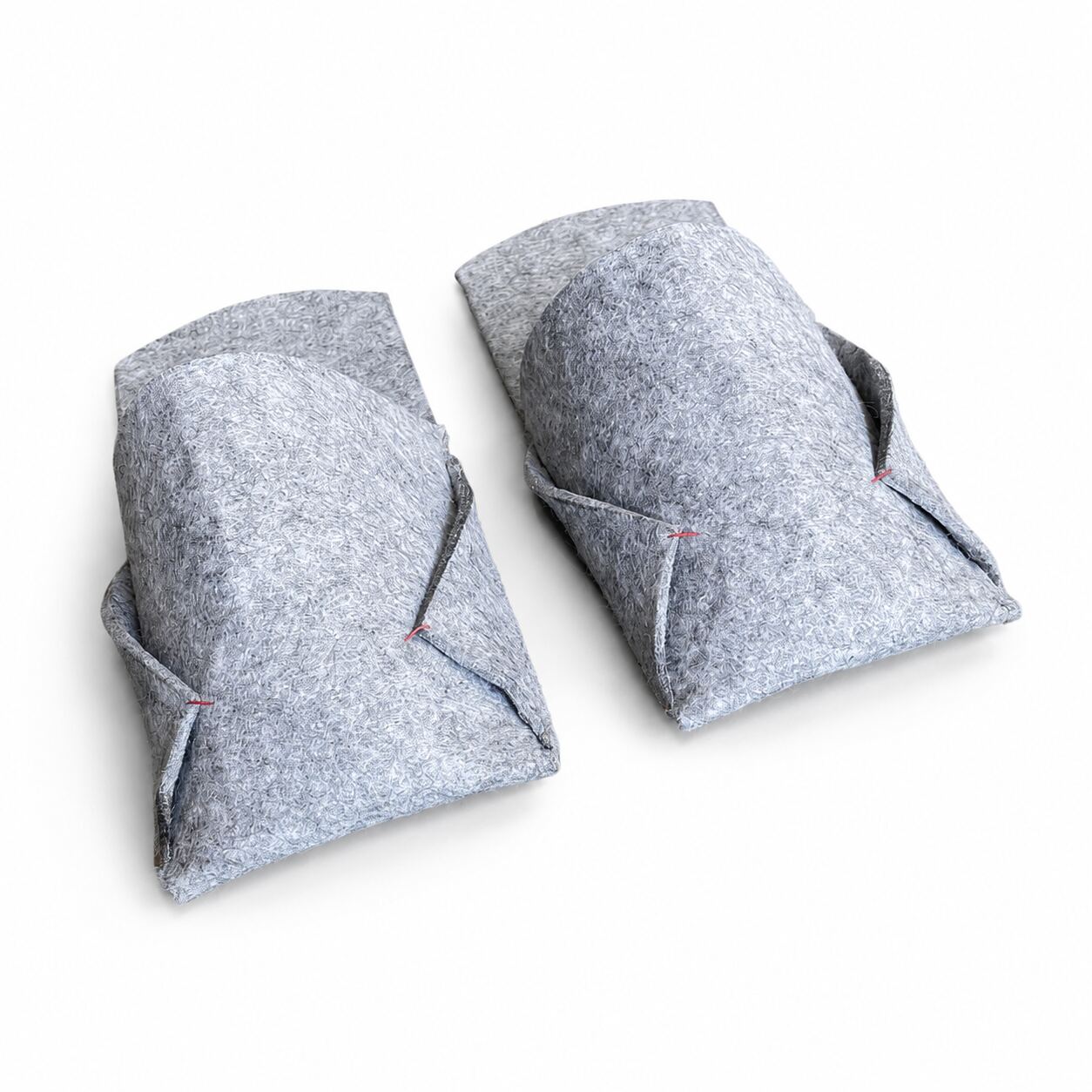 Side view of grey felted wool BAABUK slippers with structured wool upper and red stitching
