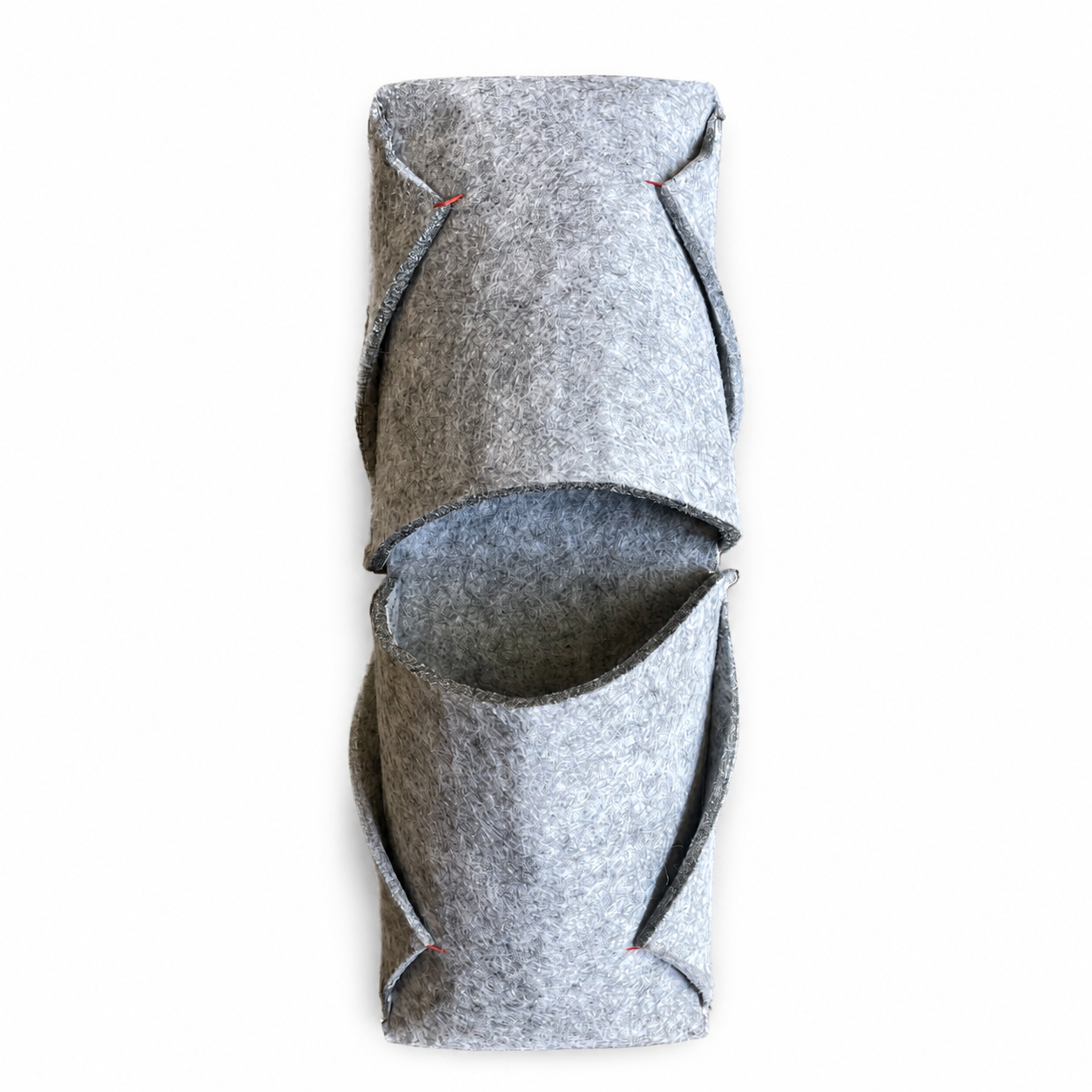 Stacked pair of grey felted wool BAABUK slippers showing the fold-over shape and red thread details